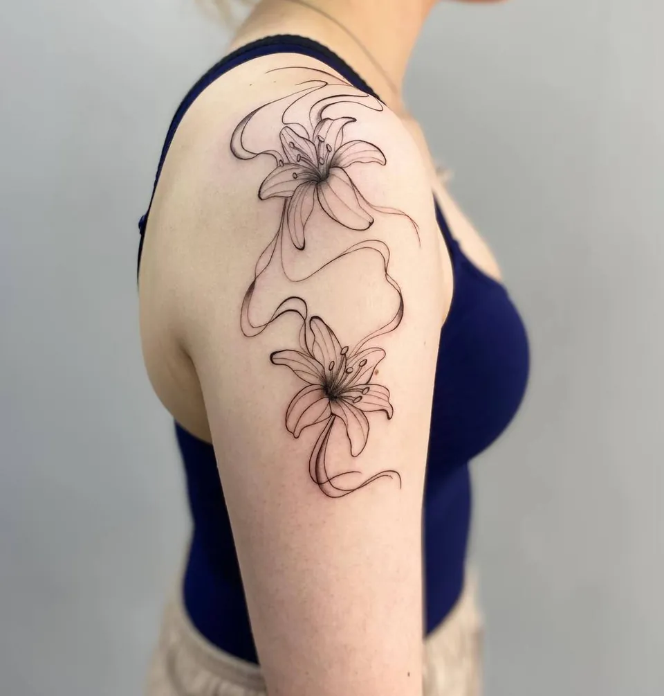 Fine-line lilies with flowing lines on the shoulder